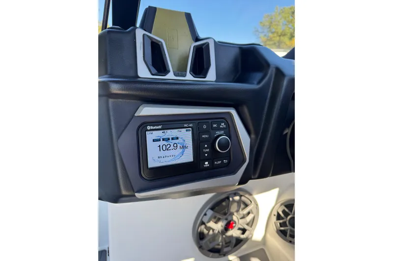 Slide: The Image of 2023 Axis T220 boat dashboard with steering wheel and digital display. - 35