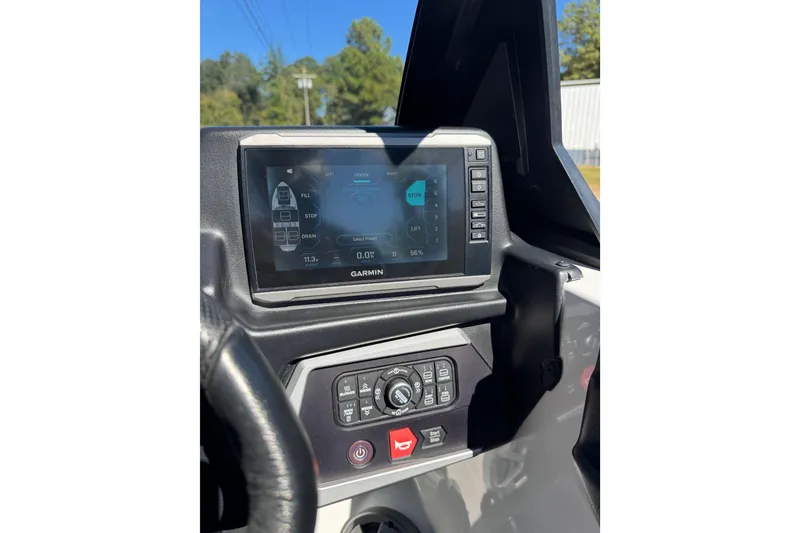 Slide: The Image of 2023 Axis T220 boat dashboard with Bluetooth stereo system displaying 102.9 MHz. - 36