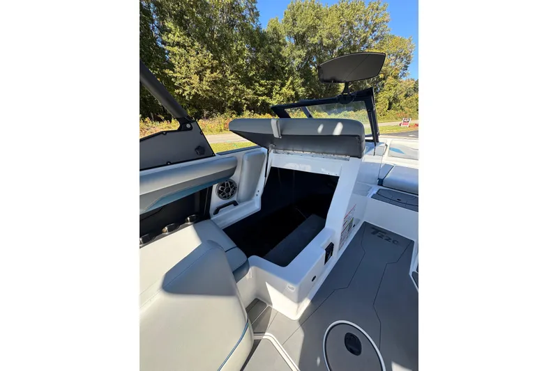 Slide: The Image of 2023 Axis T220 boat interior with open storage compartment and seating. - 39