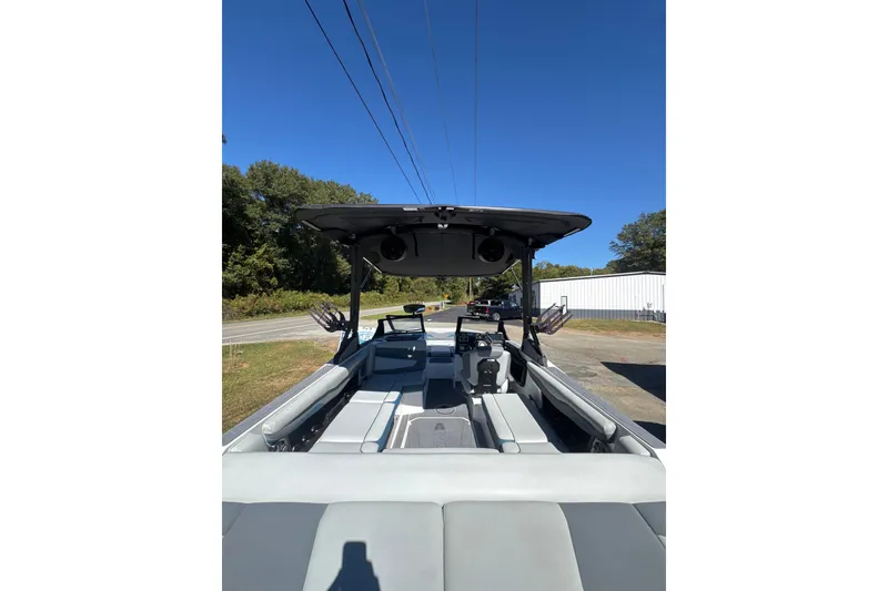 Slide: The Image of 2023 Axis T220 boat dashboard with steering wheel and digital displays. - 7