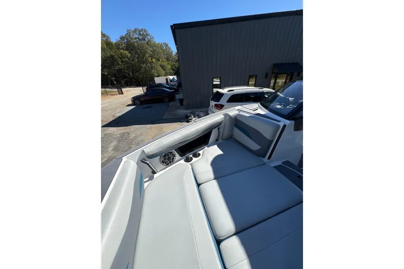 Slide: The Image of 2023 Axis T220 boat interior with modern seating and steering wheel. - 9