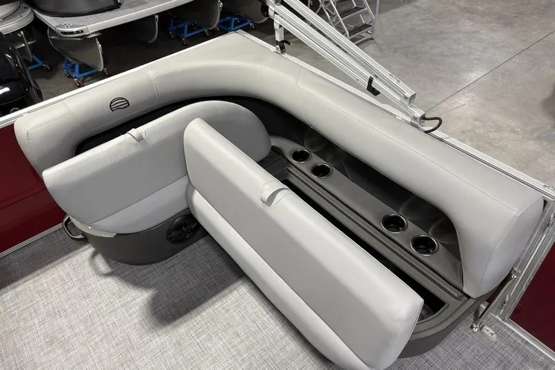 Slide: The Image of 2026 Sun Tracker Party Barge 16 DLX interior seating with cup holders and storage. - 14