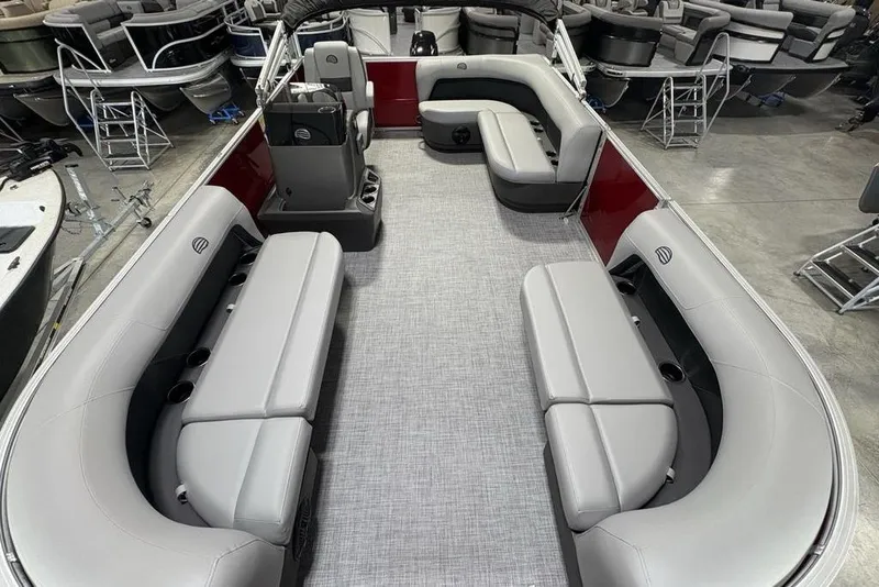 Slide: The Image of 2026 Sun Tracker Party Barge 16 DLX interior with gray seating and spacious layout. - 19