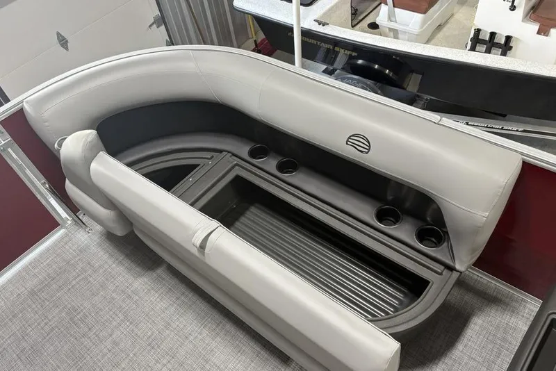 Slide: The Image of 2026 Sun Tracker Party Barge 16 DLX interior with cushioned seating and cup holders. - 5