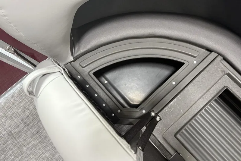 Slide: The Image of 2026 Sun Tracker Party Barge 16 DLX seating and storage compartment detail. - 6