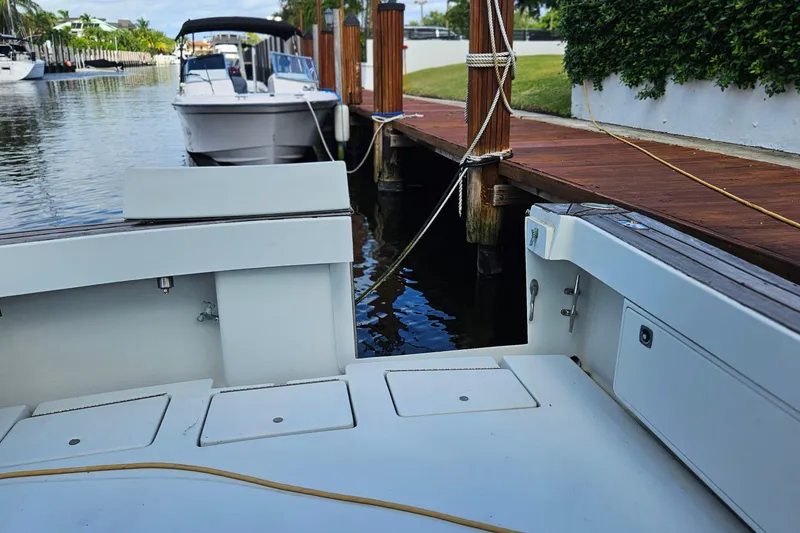 Slide: The Image of 1987 Rampage 28 Sportsman boat interior with latch and cleat details. - 22