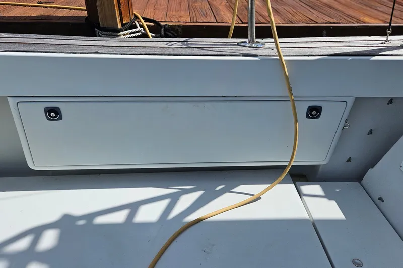 Slide: The Image of Deck of 1987 Rampage 28 Sportsman boat with storage compartments. - 34