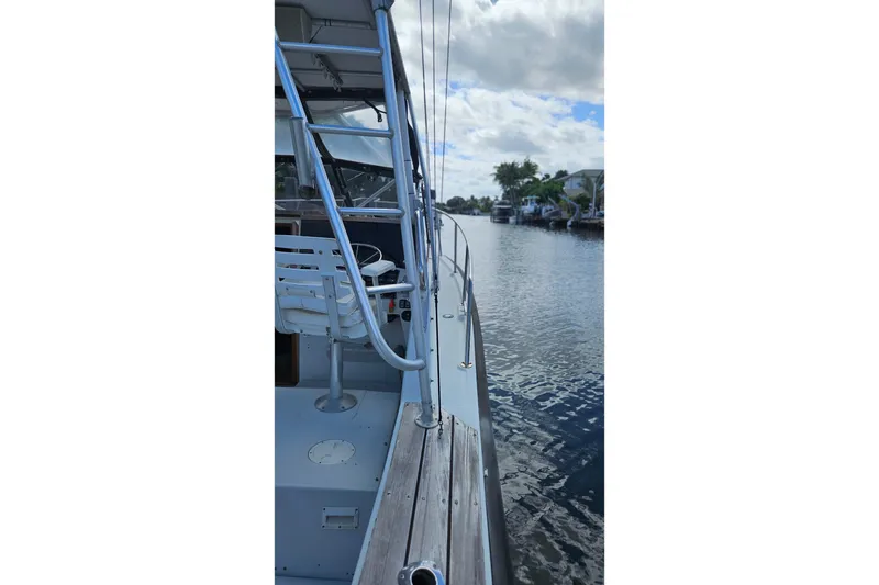Slide: The Image of 1987 Rampage 28 Sportsman boat cockpit with steering wheel, seating, and control panel. - 8