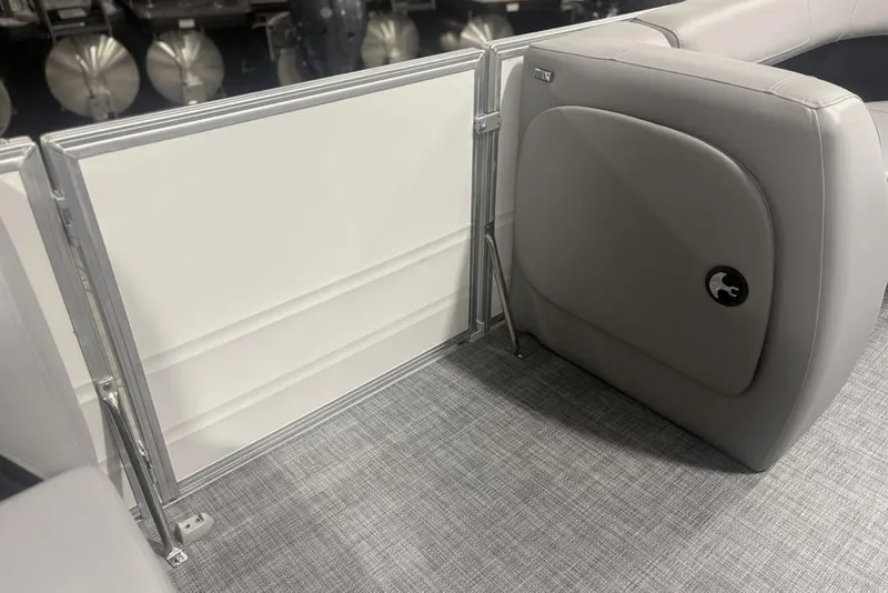 Slide: The Image of 2026 Sun Tracker Party Barge 18 DLX interior with gray seating and flooring. - 10