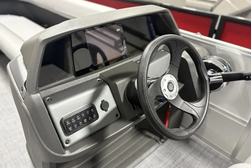 Slide: The Image of 2026 Sun Tracker Party Barge 18 DLX steering console with modern controls and display. - 11