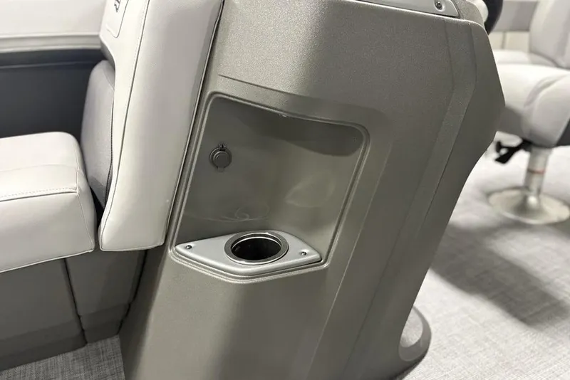 Slide: The Image of 2026 Sun Tracker Party Barge 18 DLX interior with cup holder and seating. - 12