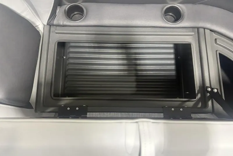 Slide: The Image of 2026 Sun Tracker Party Barge 18 DLX storage compartment with cup holders. - 14