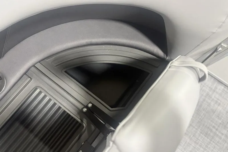 Slide: The Image of 2026 Sun Tracker Party Barge 18 DLX interior storage compartment detail. - 15