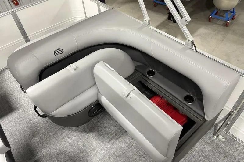 Slide: The Image of 2026 Sun Tracker Party Barge 18 DLX seating with storage compartment and cup holders. - 16