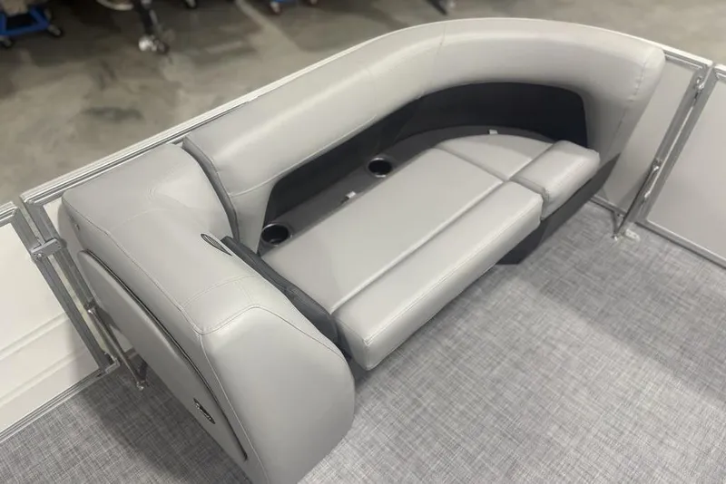 Slide: The Image of 2026 Sun Tracker Party Barge 18 DLX interior seating with cup holders, gray upholstery. - 4