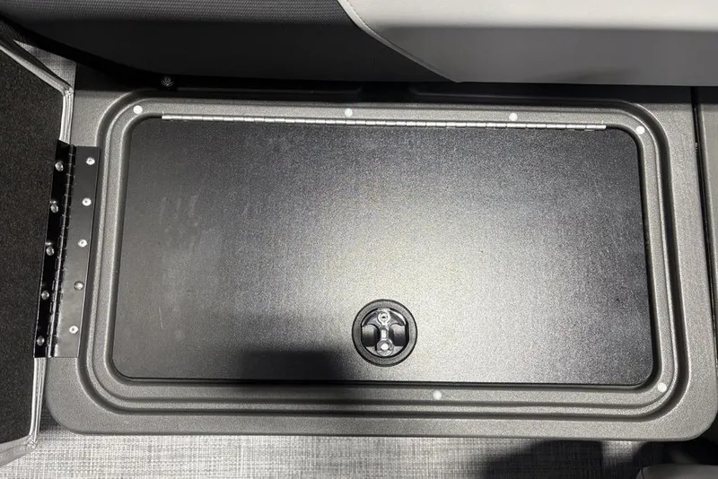 Slide: The Image of 2026 Sun Tracker PARTY BARGE® 20 DLX storage compartment with secure latch. - 31