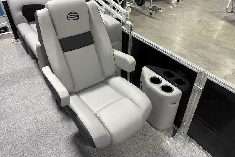 Slide: The Image of 2026 Sun Tracker Party Barge 22 XP3 interior with plush seating and cup holders. - 18