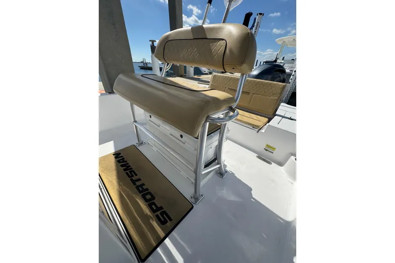 Slide: The Image of 2021 Sportsman Tournament 234 SBX Bay Boat with tan seating and sleek design. - 13