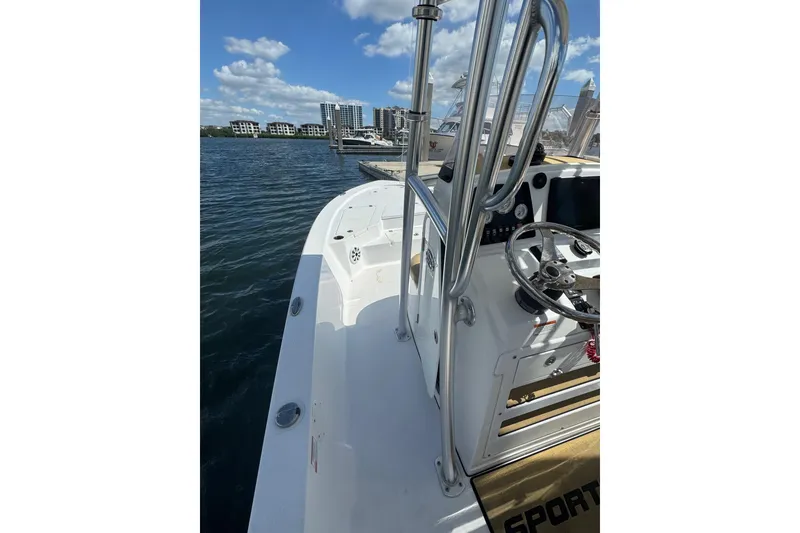 Slide: The Image of 2021 Sportsman Tournament 234 SBX Bay Boat docked, featuring sleek design and modern controls. - 15