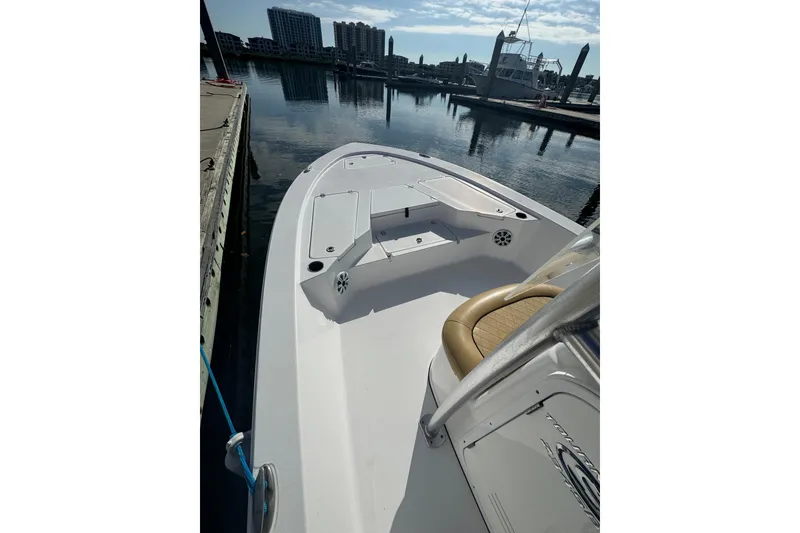 Slide: The Image of 2021 Sportsman Tournament 234 SBX Bay Boat docked in marina, sunny day. - 18