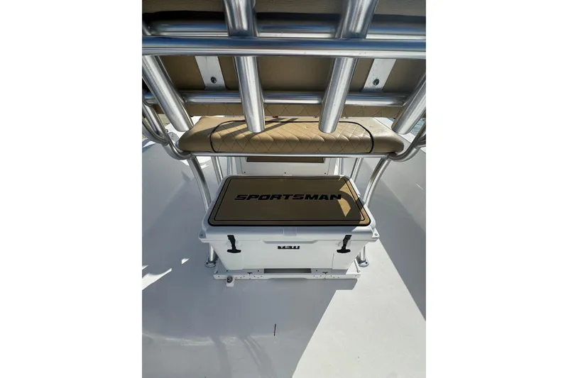 Slide: The Image of 2021 Sportsman Tournament 234 SBX Bay Boat with cooler and seating area. - 23