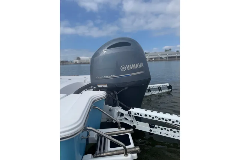 Slide: The Image of 2021 Sportsman Tournament 234 SBX Bay Boat with Yamaha outboard engine on water. - 3