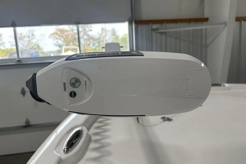 Slide: The Image of 2026 Tidewater 2210 Carolina Bay boat storage compartment with secure latch and hinges. - 10