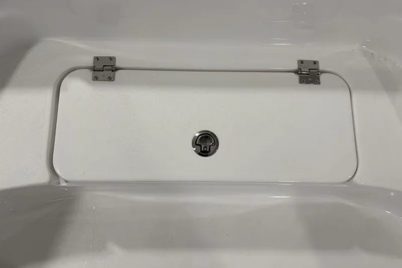 Slide: The Image of Livewell of 2026 Tidewater 2210 Carolina Bay boat, featuring a sleek blue interior. - 11