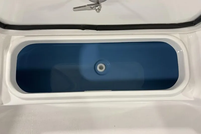 Slide: The Image of 2026 Tidewater 2210 Carolina Bay boat deck with storage compartments and cup holder. - 12