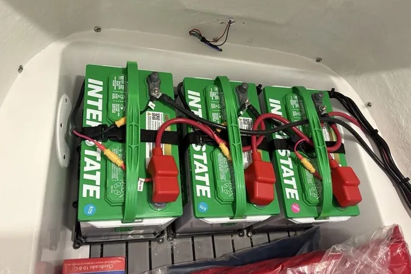 Slide: The Image of 2026 Tidewater 2210 Carolina Bay boat seats with black and white upholstery in showroom. - 19