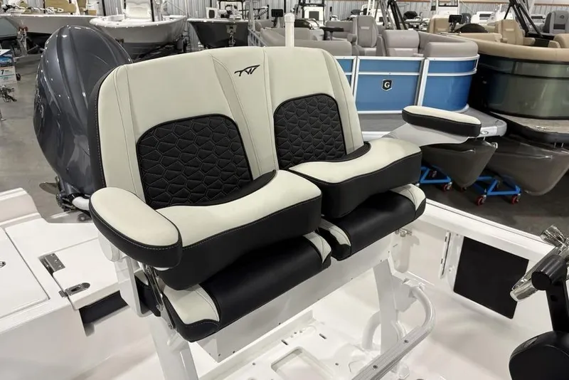 Slide: The Image of 2026 Tidewater 2210 Carolina Bay storage compartment with safety equipment and disposal instructions. - 21