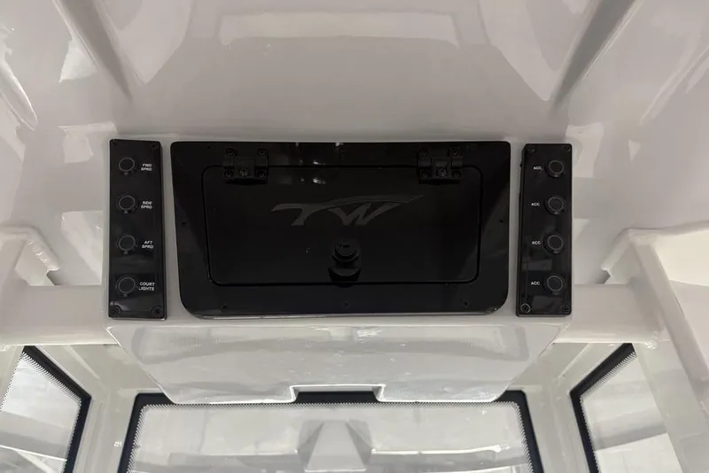 Slide: The Image of Control panel of 2026 Tidewater 2210 Carolina Bay boat with labeled switches. - 24