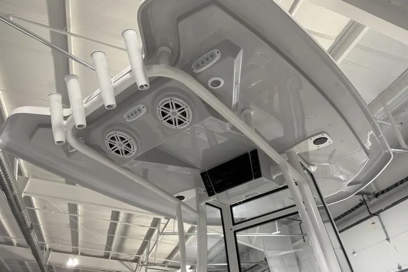 Slide: The Image of Livewell compartment on 2026 Tidewater 2210 Carolina Bay boat, featuring a blue interior. - 28