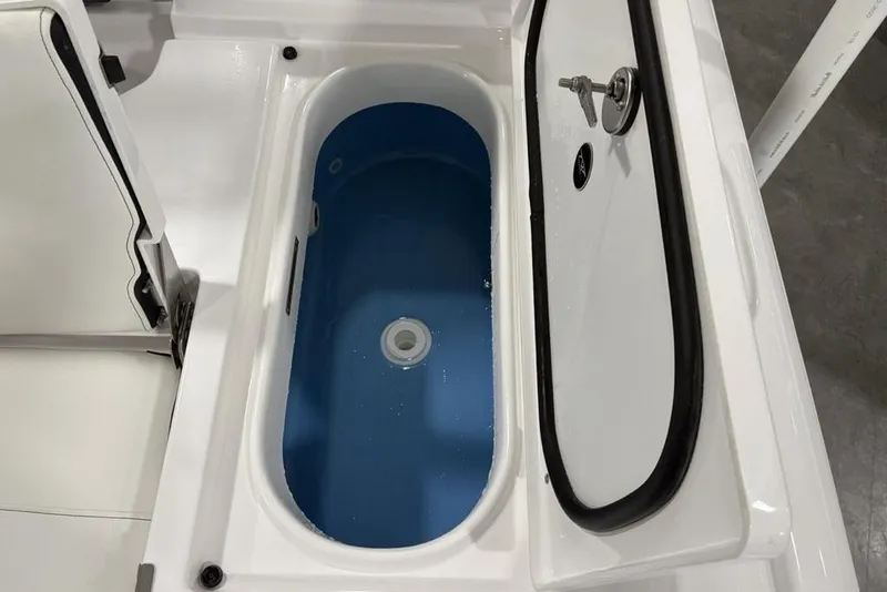 Slide: The Image of 2026 Tidewater 2210 Carolina Bay boat interior with storage compartments and seating. - 29