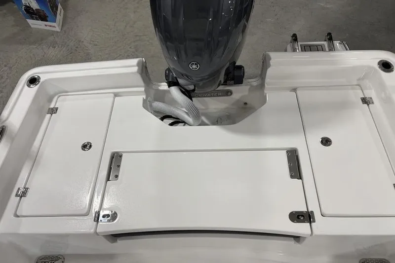 Slide: The Image of 2026 Tidewater 2210 Carolina Bay boat storage compartments with secure latches and organized interior. - 32