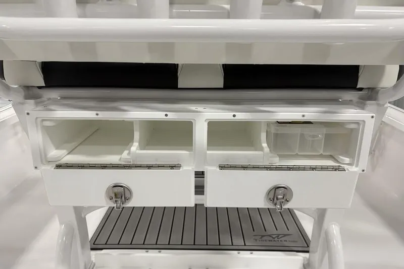 Slide: The Image of 2026 Tidewater 2210 Carolina Bay boat interior with speaker and storage compartment. - 33