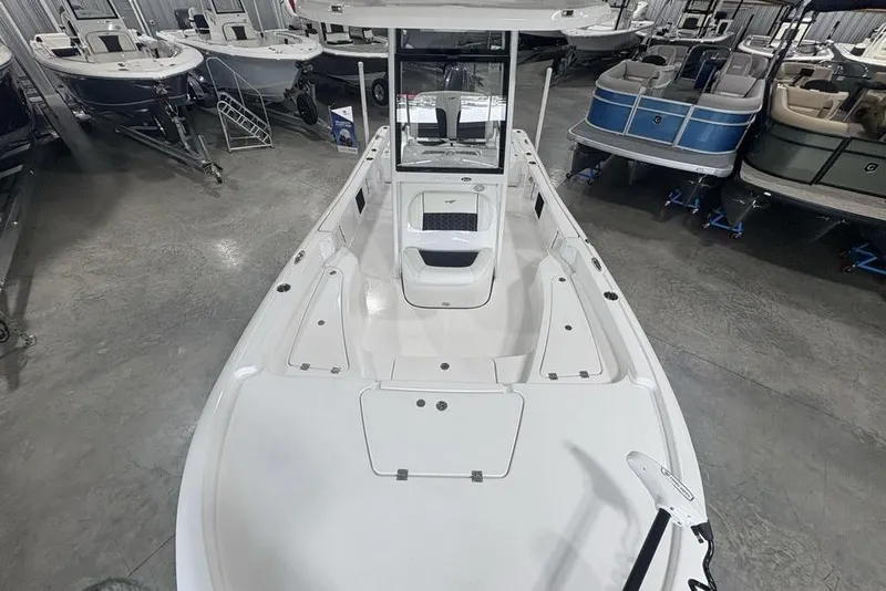 Slide: The Image of Livewell compartment in 2026 Tidewater 2210 Carolina Bay boat, featuring a blue interior. - 35