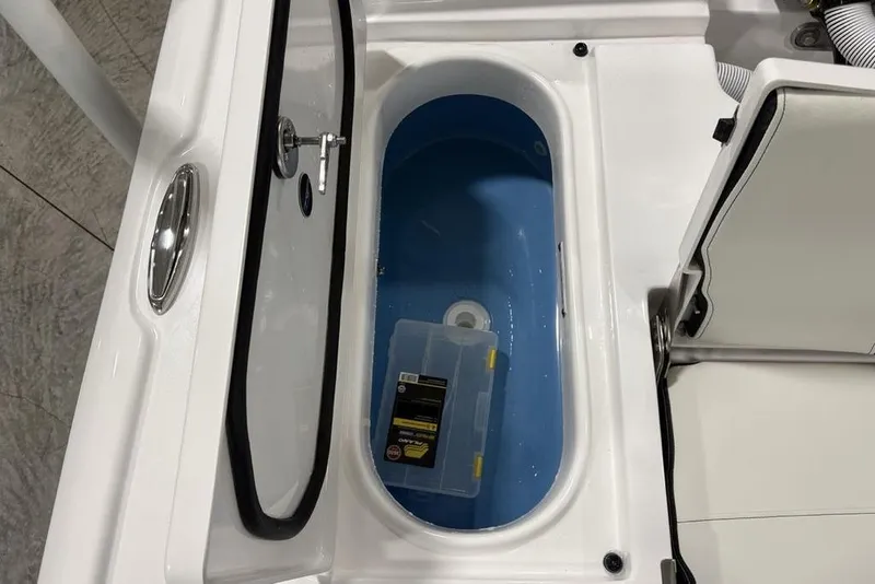 Slide: The Image of 2026 Tidewater 2210 Carolina Bay boat in a spacious indoor storage facility. - 36