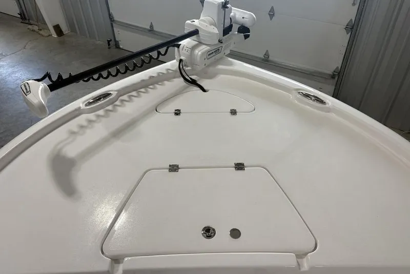 Slide: The Image of Bow of 2026 Tidewater 2210 Carolina Bay boat with trolling motor in garage. - 4