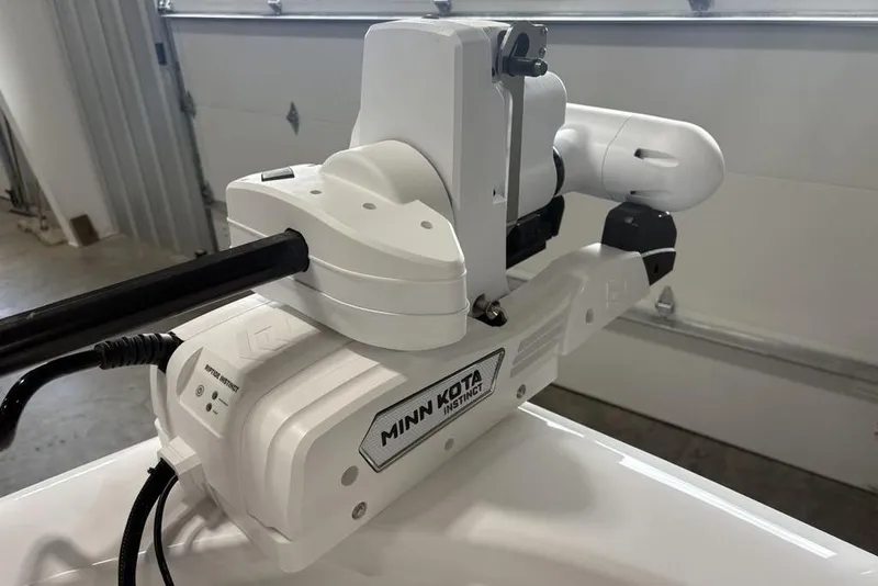 Slide: The Image of 2026 Tidewater 2210 Carolina Bay boat compartment with secure latch and hinges. - 6