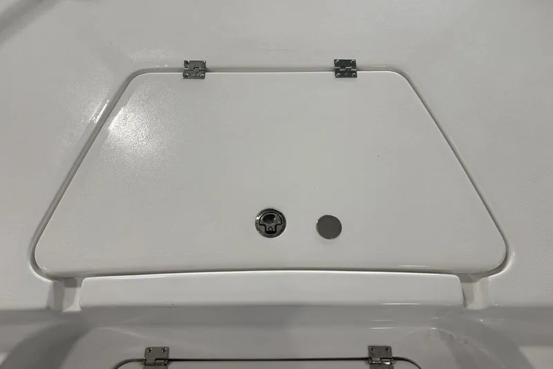 Slide: The Image of 2026 Tidewater 2210 Carolina Bay boat interior with storage compartments and sleek design. - 7