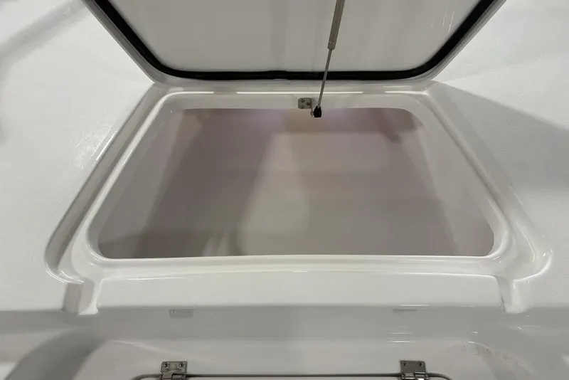 Slide: The Image of Close-up of a 2026 Tidewater 2210 Carolina Bay boat component in a garage setting. - 9