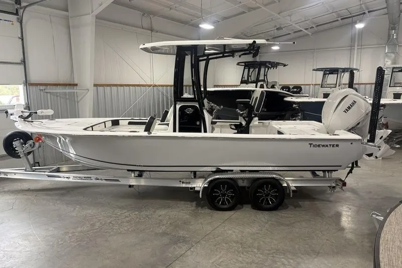 The Image of 2026 Tidewater 2300 Carolina Bay boat on trailer in showroom. - 1