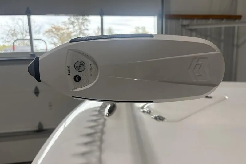 Slide: The Image of Close-up of a 2026 Tidewater 2300 Carolina Bay boat accessory in a garage. - 2