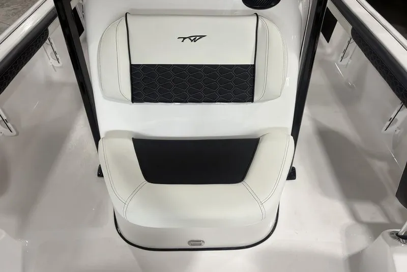 Slide: The Image of 2026 Tidewater 2300 Carolina Bay boat seat with black and white upholstery design. - 23