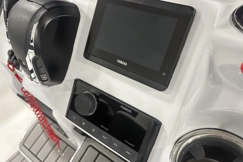 Slide: The Image of Control panel of 2026 Tidewater 2300 Carolina Bay boat with Yamaha and Fusion displays. - 26