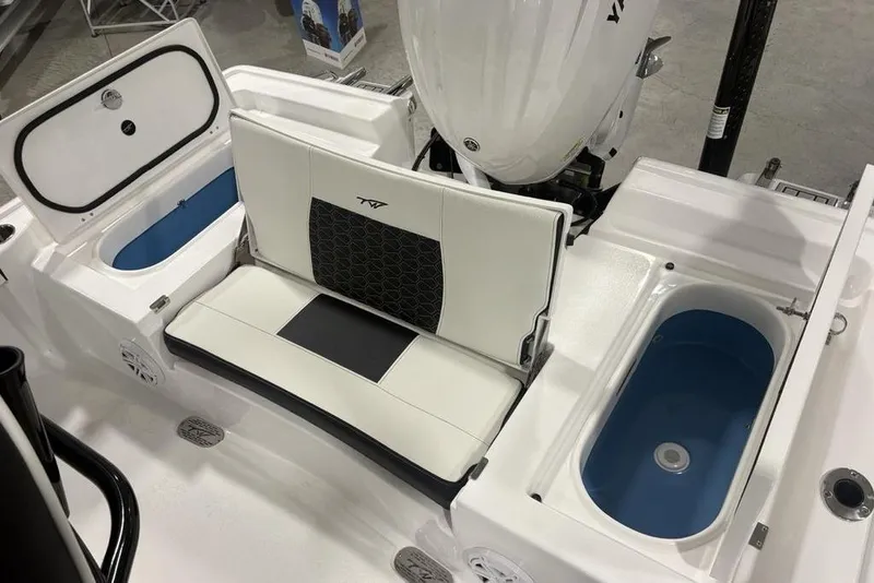 Slide: The Image of 2026 Tidewater 2300 Carolina Bay boat interior with seating and storage compartments. - 36