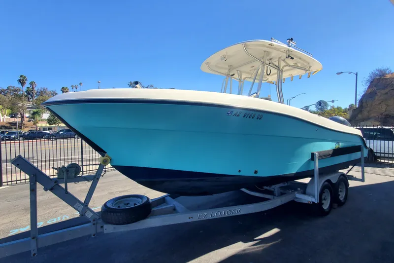 Slide: The Image of 2009 Hydra-Sports 2500 CC boat on trailer, parked outdoors under clear blue sky. - 1