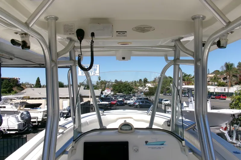 Slide: The Image of 2009 Hydra-Sports 2500 CC boat interior with steering console and overhead electronics. - 14
