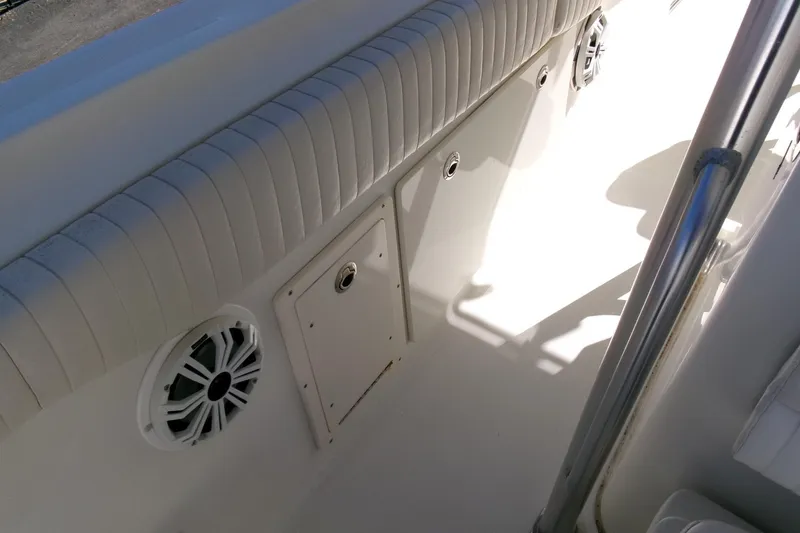 Slide: The Image of Interior view of 2009 Hydra-Sports 2500 CC boat, featuring seating and speaker. - 20